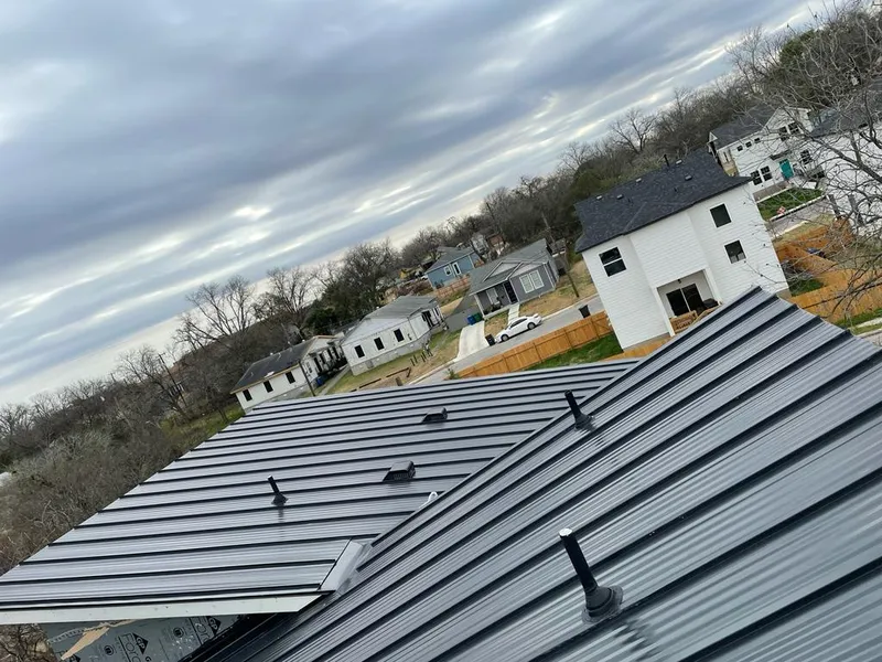 Standing seam metal roof panels with vents for Skylight Repair in Erie